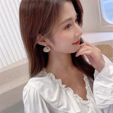 AndQ【The Feather of the Flower】Pistil Zircon Like Feather Earrings